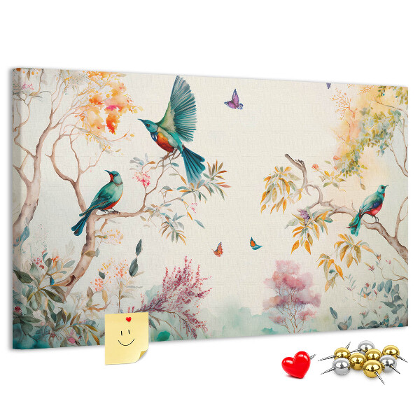 Pizarra de corcho con diseño de pájaros coloridos en un paisaje primaveral