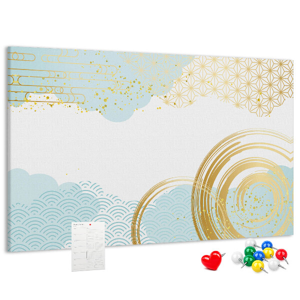 Pizarra de corcho con diseño de espirales doradas sobre fondo azul