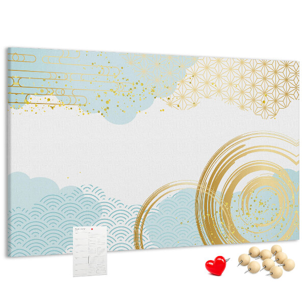 Pizarra de corcho con diseño de espirales doradas sobre fondo azul