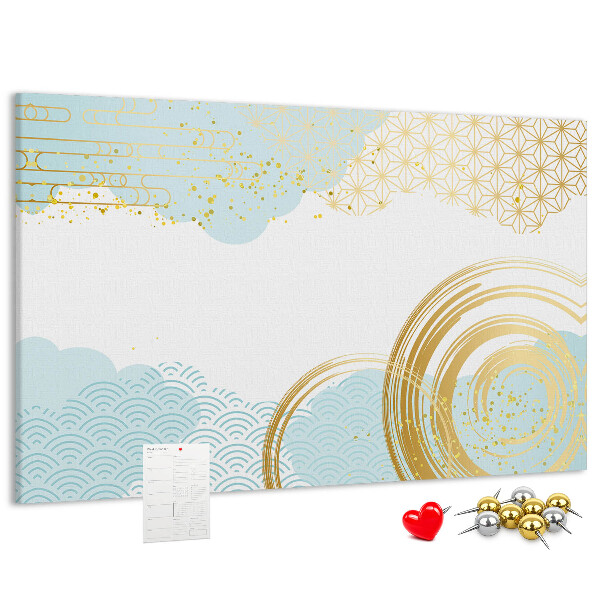 Pizarra de corcho con diseño de espirales doradas sobre fondo azul