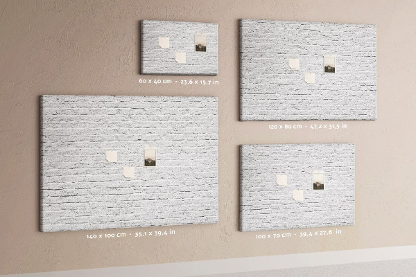 Tablero de anuncios con diseño de pared de ladrillo blanco y chinchetas de colores