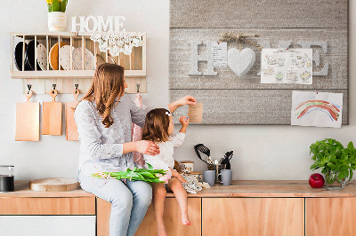 Tablero de corcho decorativo con elegante inscripción HOME y un corazón