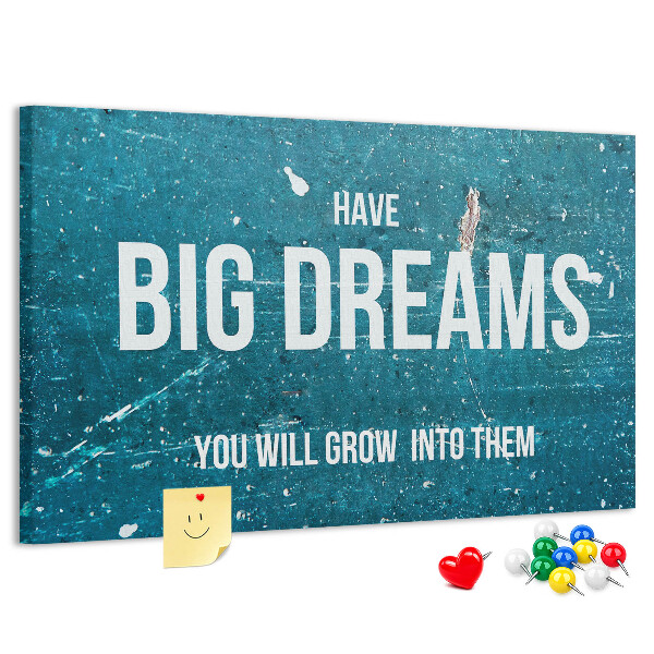 Tablero de corcho decorado con diseño de sueños sobre fondo azul