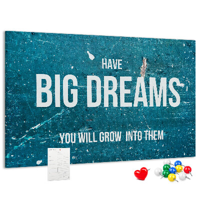 Tablero de corcho decorado con diseño de sueños sobre fondo azul