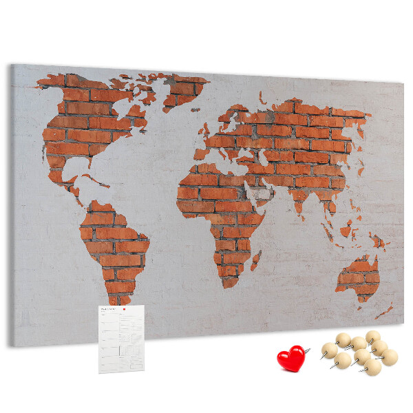Tablero de corcho decorado Un mapamundi contra una pared de ladrillos
