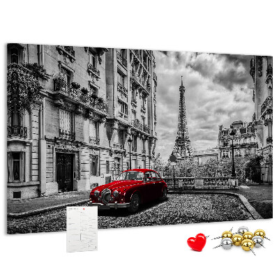 Tablero de anuncios Un coche rojo con París al fondo.