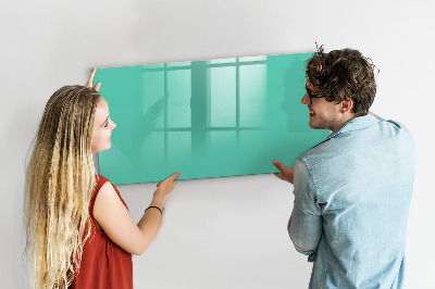 Pizarra borrable de cristal con imanes Un tablero colorido para notas y fotos.