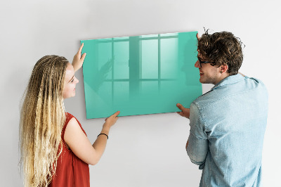 Pizarra borrable de cristal con imanes Un tablero colorido para notas y fotos.