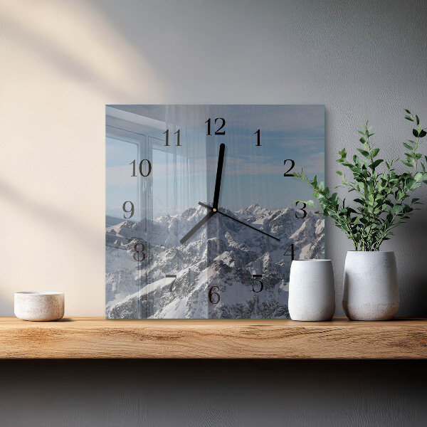 Reloj de vidrio montañas