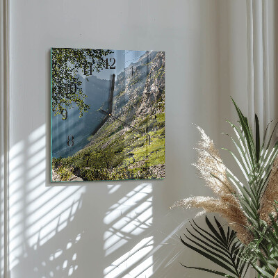 Reloj de vidrio montañas