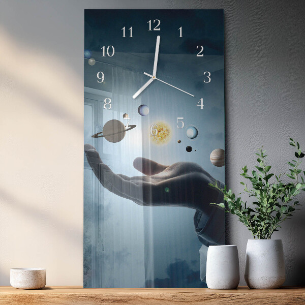 Reloj vertical Mano del Planeta