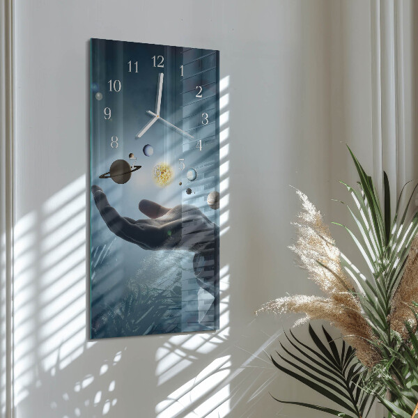 Reloj vertical Mano del Planeta